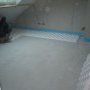 Mise en place de l'isolant du plancher chauffant